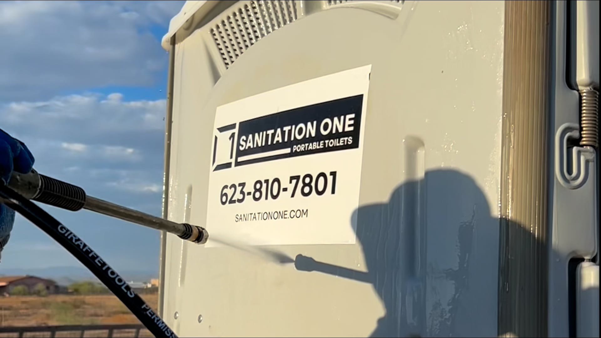Sanitation One unit being pressure washed and sanitized in the field